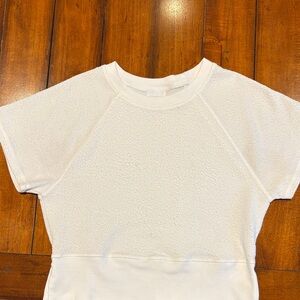 Off white textured top. 3 1/2 inch slits on waistband.